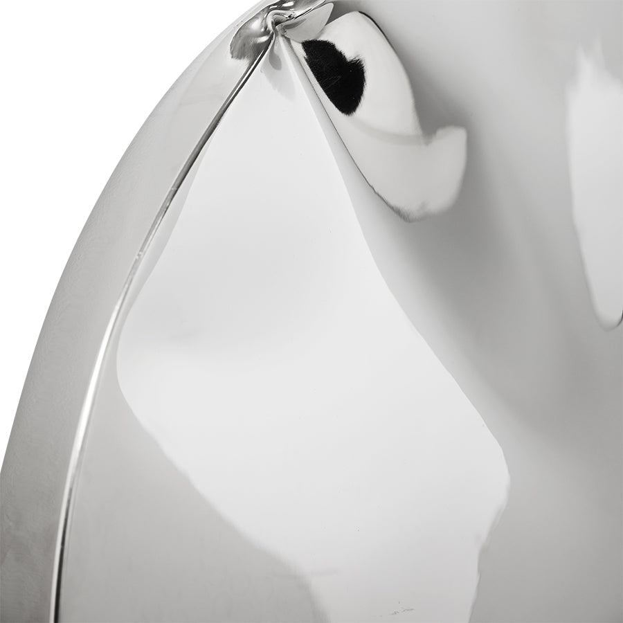 Close-up of distorted chrome reflection on HKLIVING Dent wall sculpture