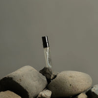 Fischersund JÓL mini fragrance spray displayed on natural stones