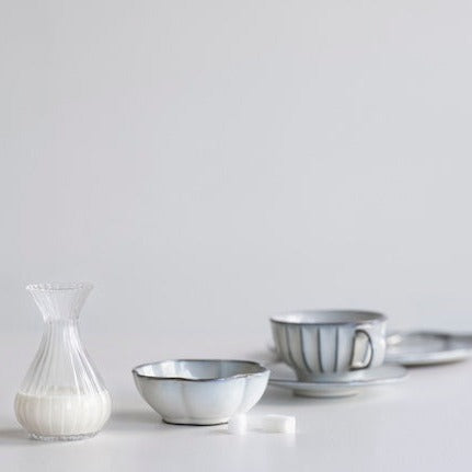 extra small carafe or milk jug with sugar bowl and tea cup on a saucer