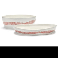 the salad serving bowl and deep serving plate next to each other showing the difference in height of these two dishes perfect for diner parties and feasts with friends in the style of ottolenghi and the qulity of searax