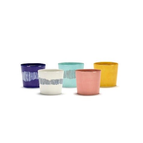 a mix and match of different colours and styles of ottolenghi cups with azure, deep blue, yellow, delicious pink, and yellow, all perfect for a daily cup or for celebratiory meals with friends and family and ottolenghi and searx