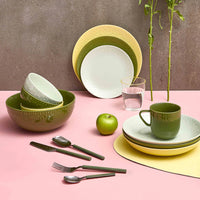 Aida Confetti olive green and silver cutlery set for four place settings styled in a table setting