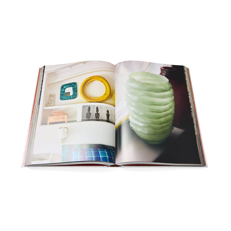 HKLIVING Limited Edition Lookbook 2026-2027 open to a lifestyle interiors spread, showing a styled shelf of objects and a close-up of a ribbed sage green vase
