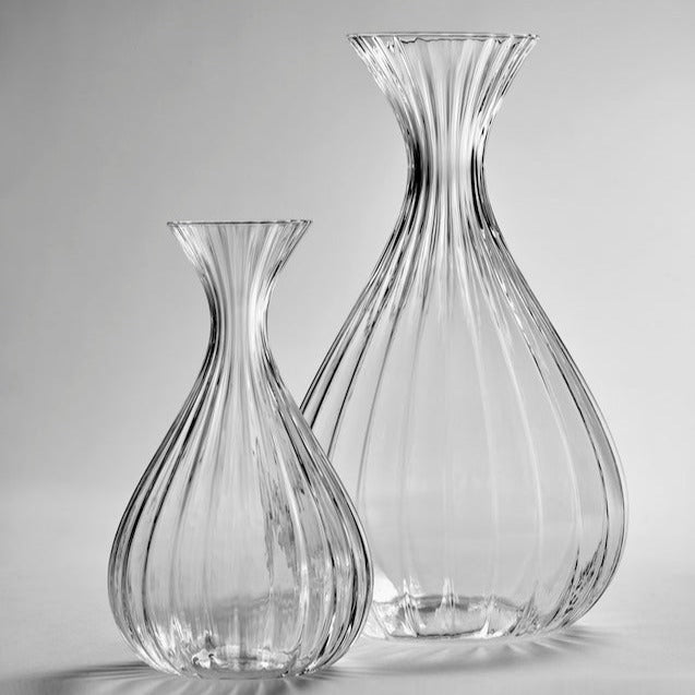 2 glass carafe stood shining next to each other