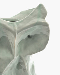 close up of the eye and face of small sculptural ceramic owl vase for design-led interiors
