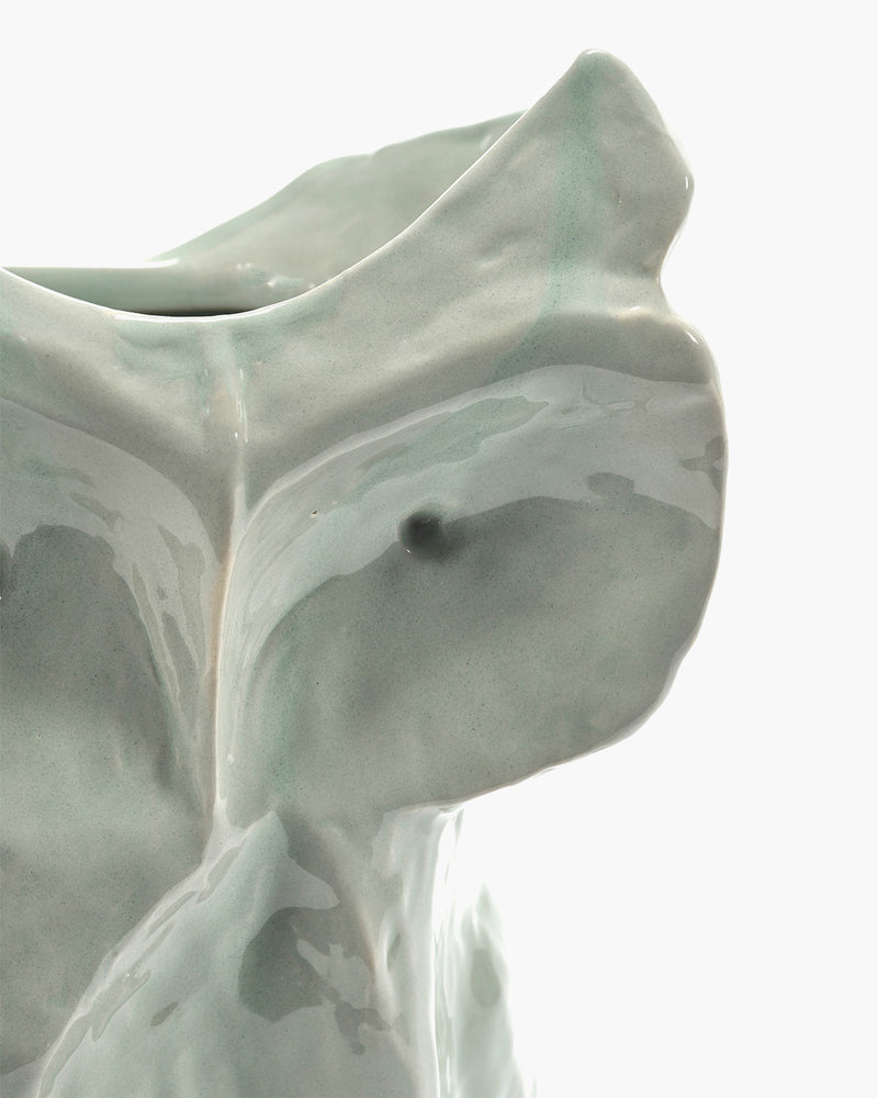 close up of the eye and face of small sculptural ceramic owl vase for design-led interiors