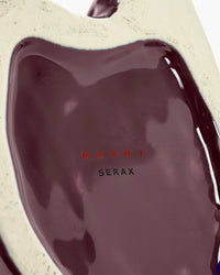Close-up of a Marni Serax product with a glossy finish.