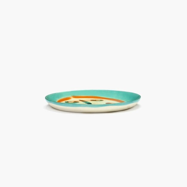 side view of the breakfast plate from the ottolenghi by serax feast range showing the azure blue lapping over the edge and still revealing the colourful face in this crockery perfect for any table