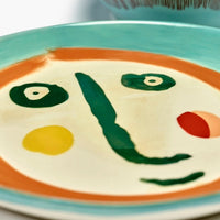 close-up of the ottolenghi handpainted face print that has become synomynous with the feast by serax range