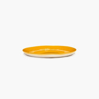 side view of sunshine yellow plate in the quality of ottolenghi