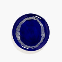 deep blue with white stripes dinner plate from ottolenghi and serax with a generous shiney glaze