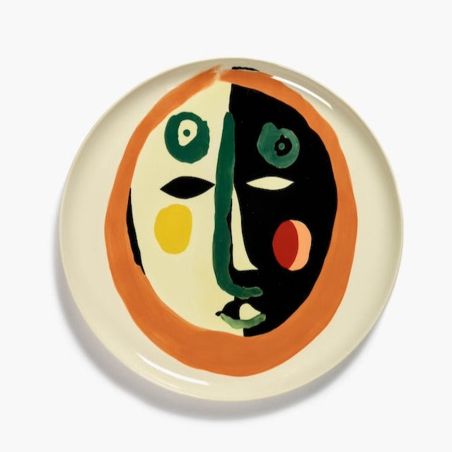 the handpainted face motif by yotam ottolenghi using colours like green for the nose and mouth creating a fun character to join any feast or dinner party and revelling in the qulaity of serax tableware