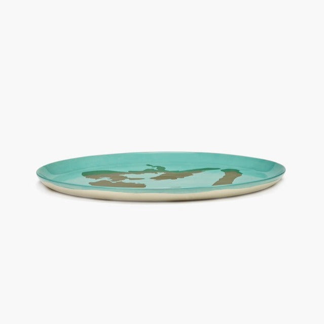 qulaity dinnerware from searx in azure blue with gold leaf in a bell pepper design by yotam ottolenghi