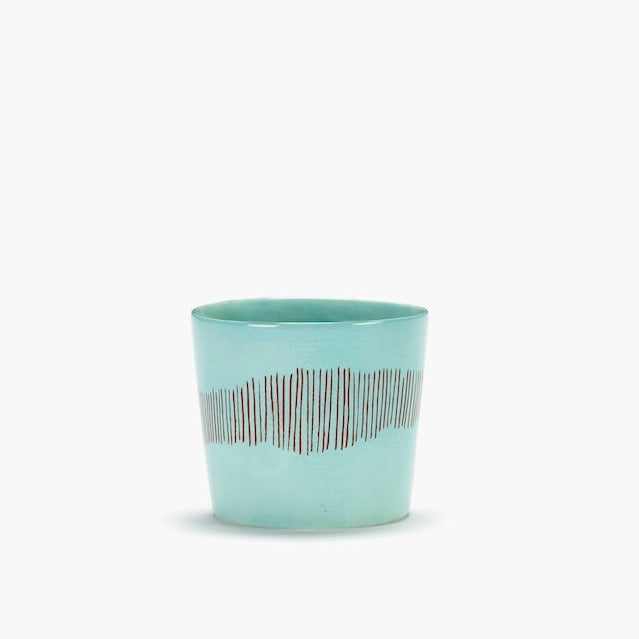 azure espresso cup with red stripes running down the side bringing joy in its vision