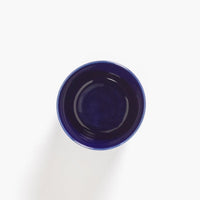 the inside of thet deep blue mug showing the shine of the heavily glazed crockery