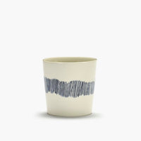 off white with black sstripes running down the side of theis straight sided coffee cup by ottolenghi 