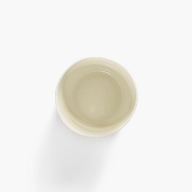 the inside of the off white straight sided coffee cup in a classic mug by yotam ottolenghi