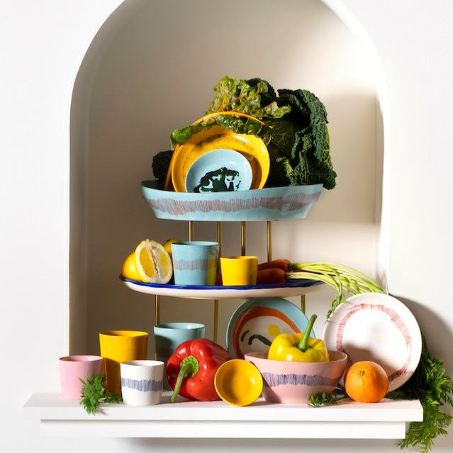 a number of different crockery and dinnerware pieces showing how the different clours and styles in this range can be used together to create a colour blast at any feast or dinner party