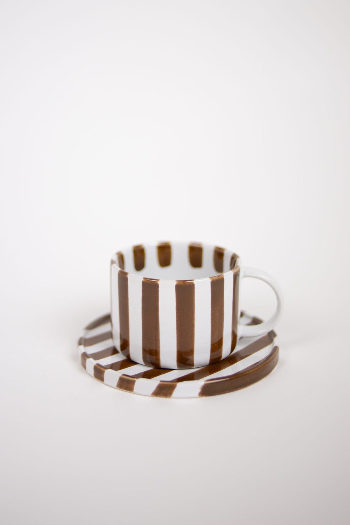Monica brown striped stoneware cup and saucer by Olsson & Jensen