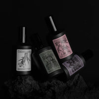 bottles of room spray fragrances in black bottles jostled together in handmade scents from icelandic art group fischersund