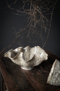 Organic-shaped stoneware bowl with wavy rim