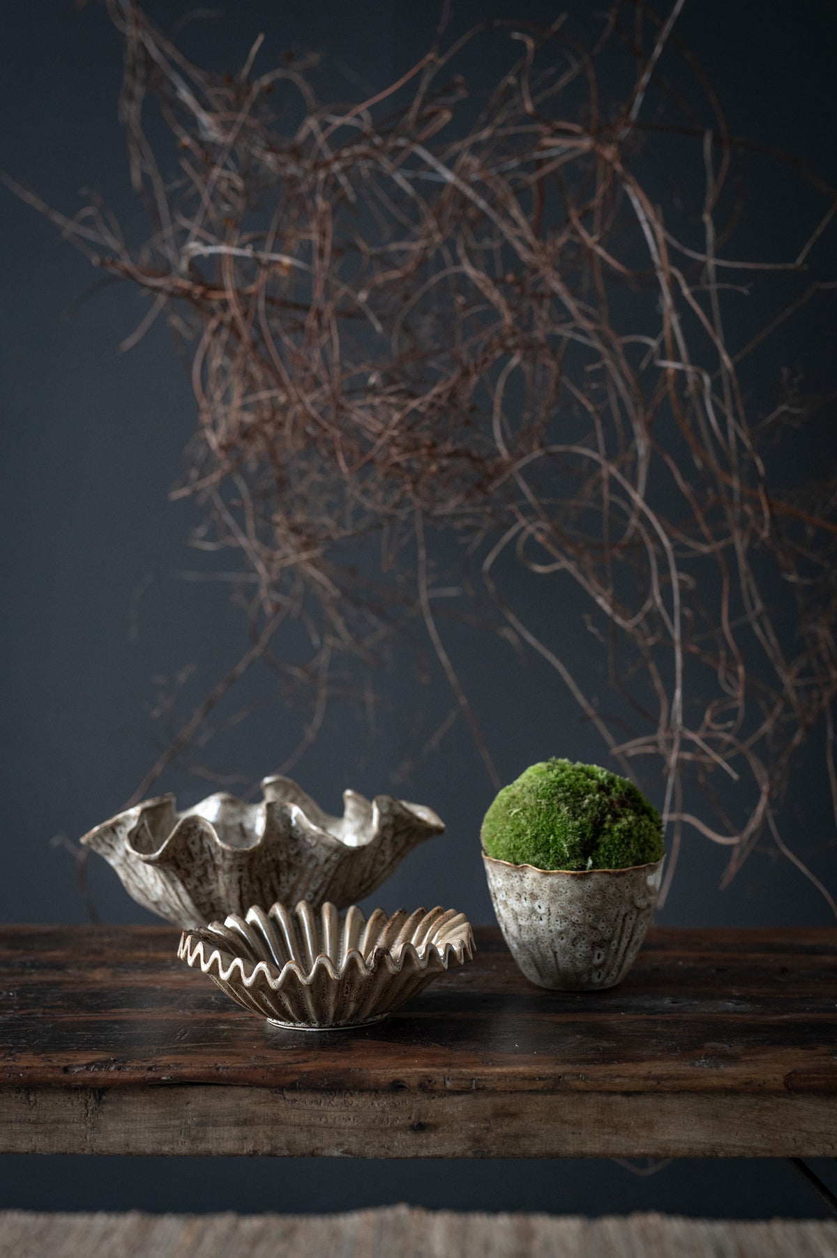 Decorative wave-edge bowl styled with moss and ceramics by Wikholmform
