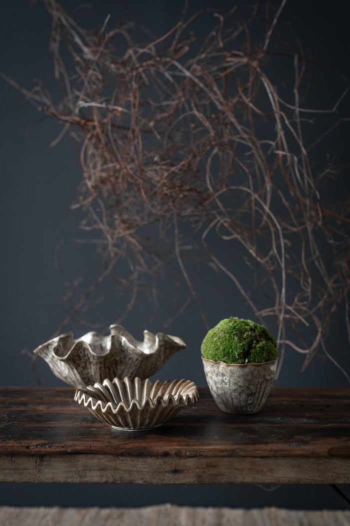 Decorative wave-edge bowl styled with moss and ceramics by Wikholmform