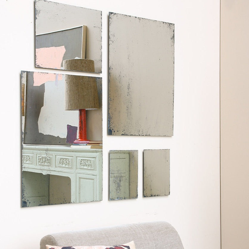 small medium and large antique mirrors form hkliving arranged together on a wall