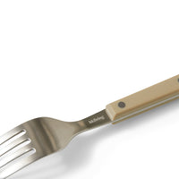 Close-up of an olive HKLIVING 70s Cutlery fork handle with rivet detail