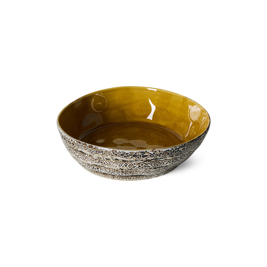 70s Ceramics Pasta Bowl in Brew shown at an angle, showing the mustard-gold interior glaze against the speckled brown exterior