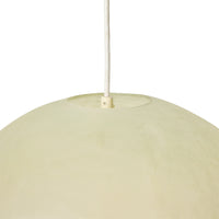 Glassfibre pendant lamp styled above a dining table