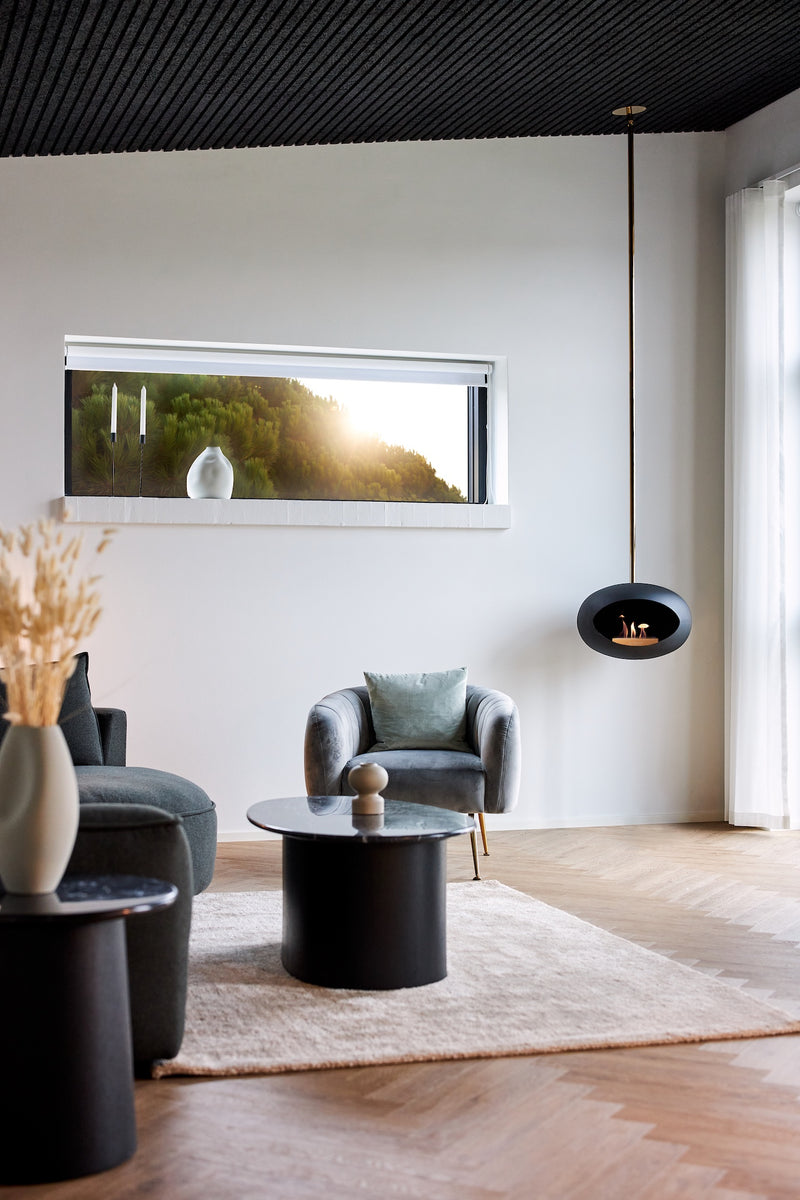 Black Le Feu Sky designer fireplace suspended from ceiling in open-plan living room
