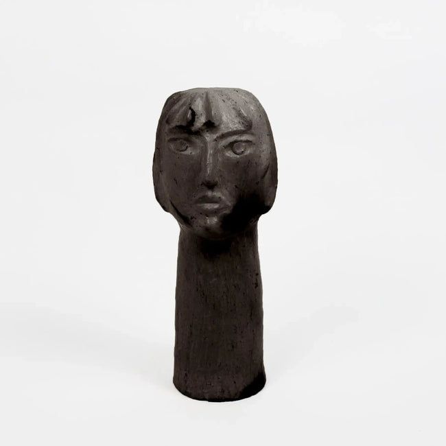handmade hand formed female figure in dark clay from tunisa 