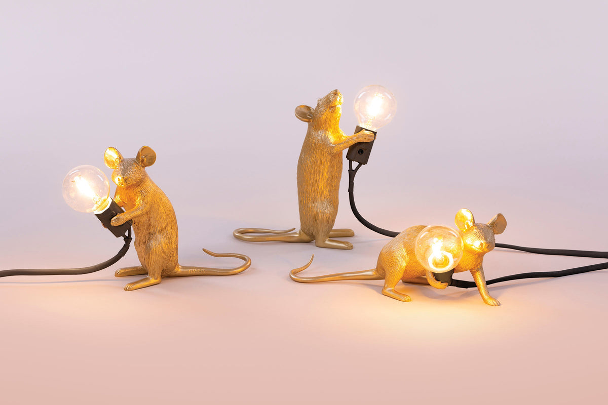 Seletti Gold Mouse Lamps in standing, sitting and lying down poses, lit up together