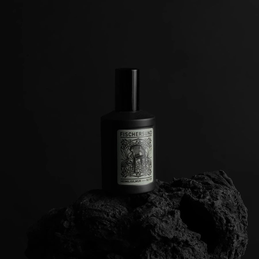 bottle of handmade icelandic room spray number 101 from fischersund or home fragrance in a black bottle reminiscent of black volcanc rocks around rejkjavik