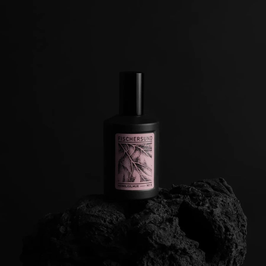 pink label of no.8 fragrance on a black spray bottle of room spray fragrance from iceland