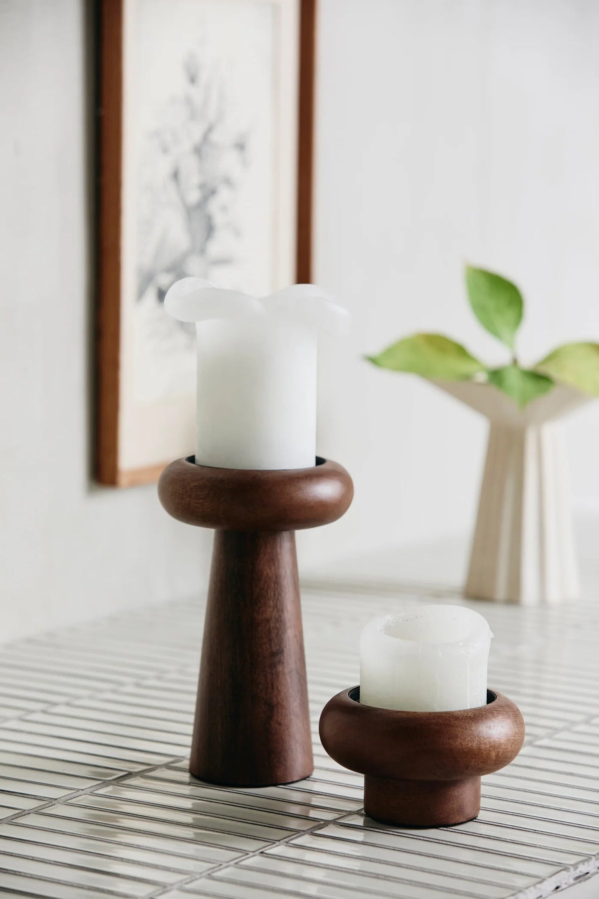 BAWE candle holders in mango wood by Nordal, S and L sizes displayed together on a tiled table