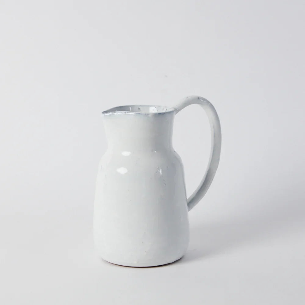 a stright sided jug with a long slender handle in white glaze handmade for style and difference