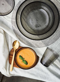 Textured serving bowls in smoke grey glass