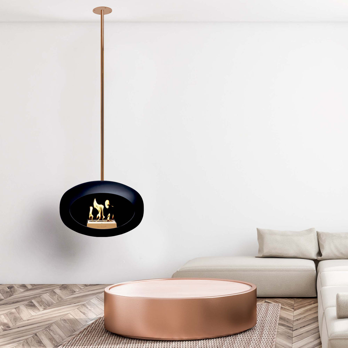 Modern living room with a black pendant le feu fireplace and a round coffee table.