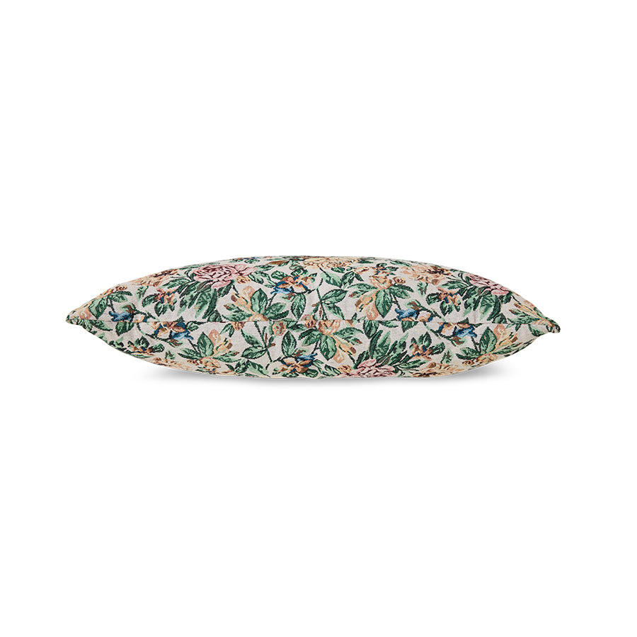 Woven Classic Flowers cushion styled on a sofa
