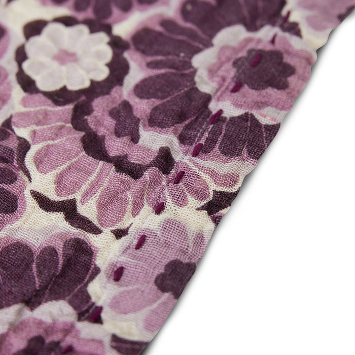 close up image of burgundy purple pink cloth napkin in floral print from hkliving