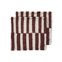 cloth napkins from hkliving with a burgundy and white stripe where the stripes are off set against each other half way down and with a burgundy stich around the outer edge