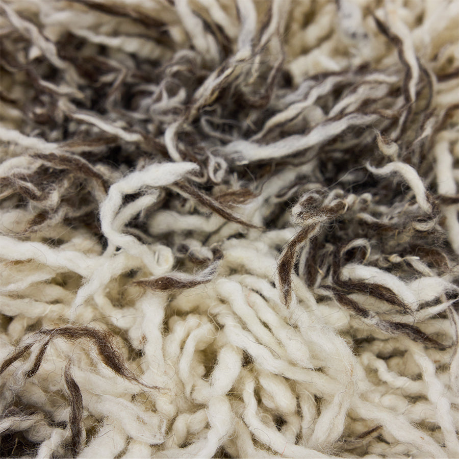 Close-up of the long ivory and brown shaggy fibres on the HKLIVING Wire Chair Comfort Kit cushion