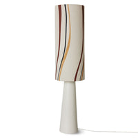 the full length floor lamp with a beige lamp base that rises up with a slight taper, and the off-white,, yellowish lamp shade that isn't stripy but does hace a few complimentary, slightly wavy stripes down it in red, black, and yellow