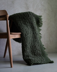Nalia wool blend throw styled over wooden chair