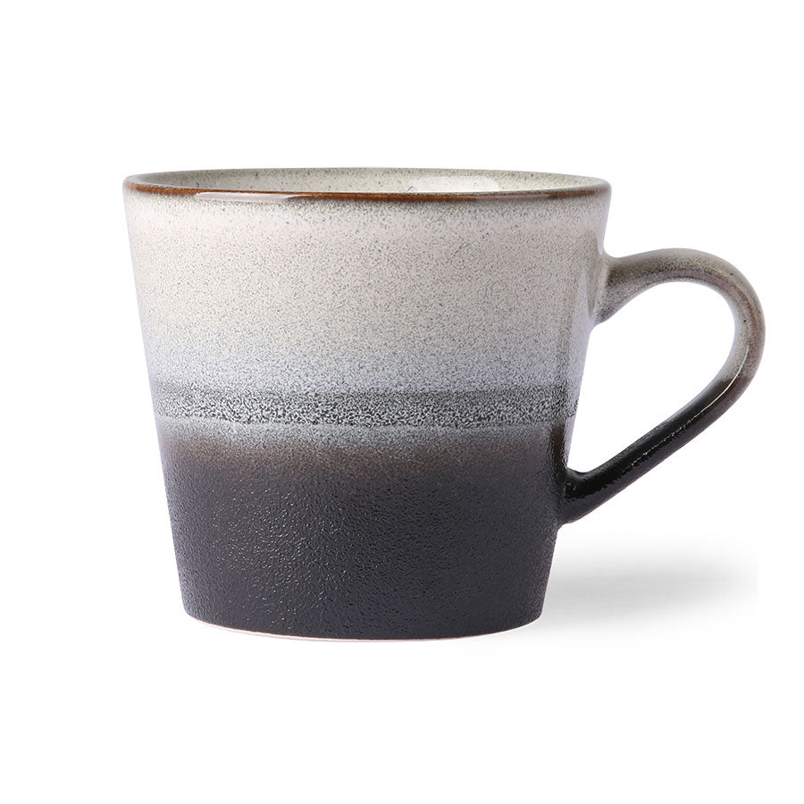 rock cappuccino mug from hkliving is reminicent of the kind of rock you'd crack open in the hope of finding a fossil with dark brown around the bottom, a ring of dark grey round the middle, and lighter speckeled grey around the top half