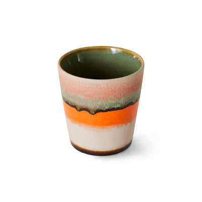 with a burst of colours from stripes of orange and pink and an inside green, a coffee mug that sparks joy with a morning coffee from hkliving in 70s colours