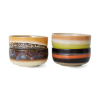 small bowl perfect for breakfast or dessert or even serving dips and tapas stacked together in miriad coours of purples, greens, browns, and striking orange. clearly hand painted by hkliving