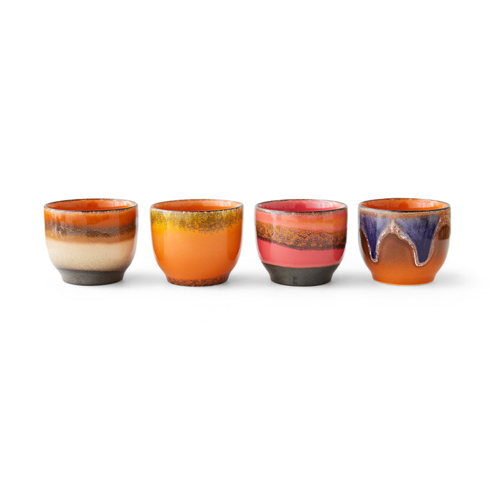 set of 4 new style coffee cups from hkliivng lined up next to each other each with a different colour style